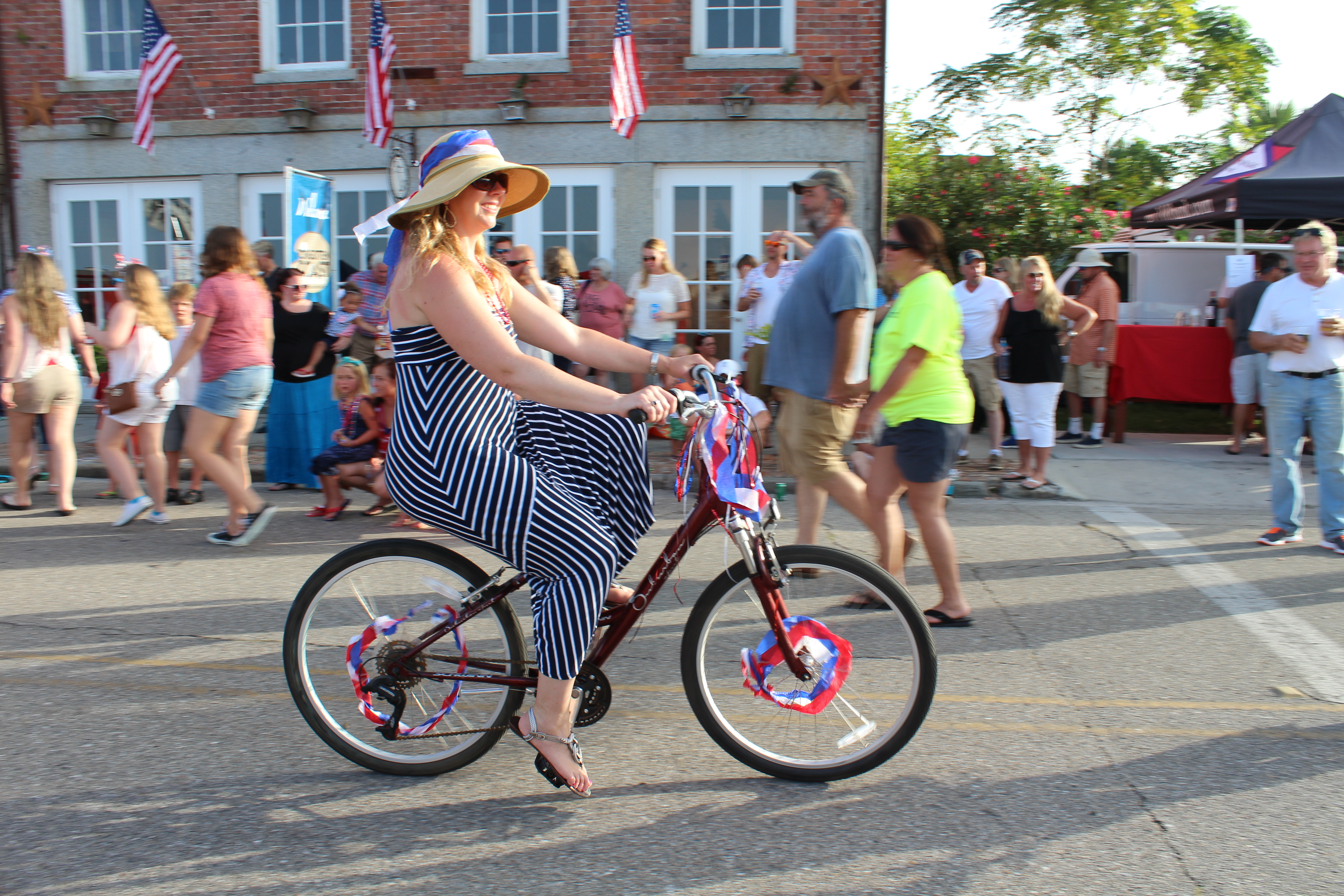 Lady riding bike in the parade